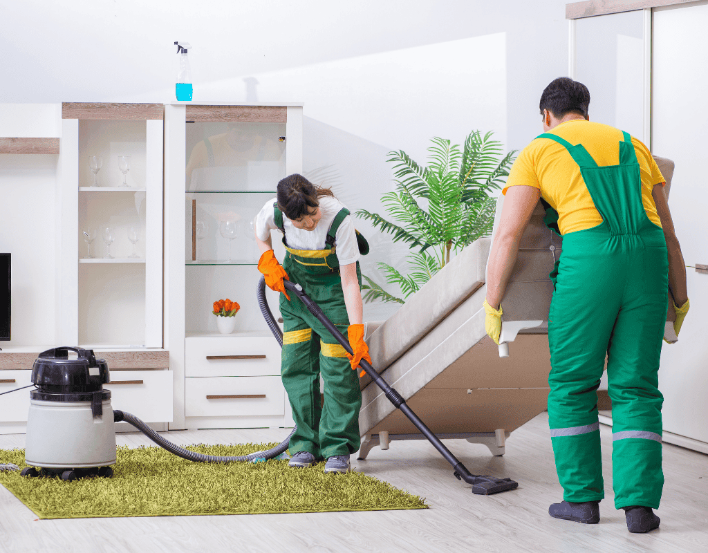 Cleaner scrubbing wooden floor with Mop and disinfectant during deep house cleaning service