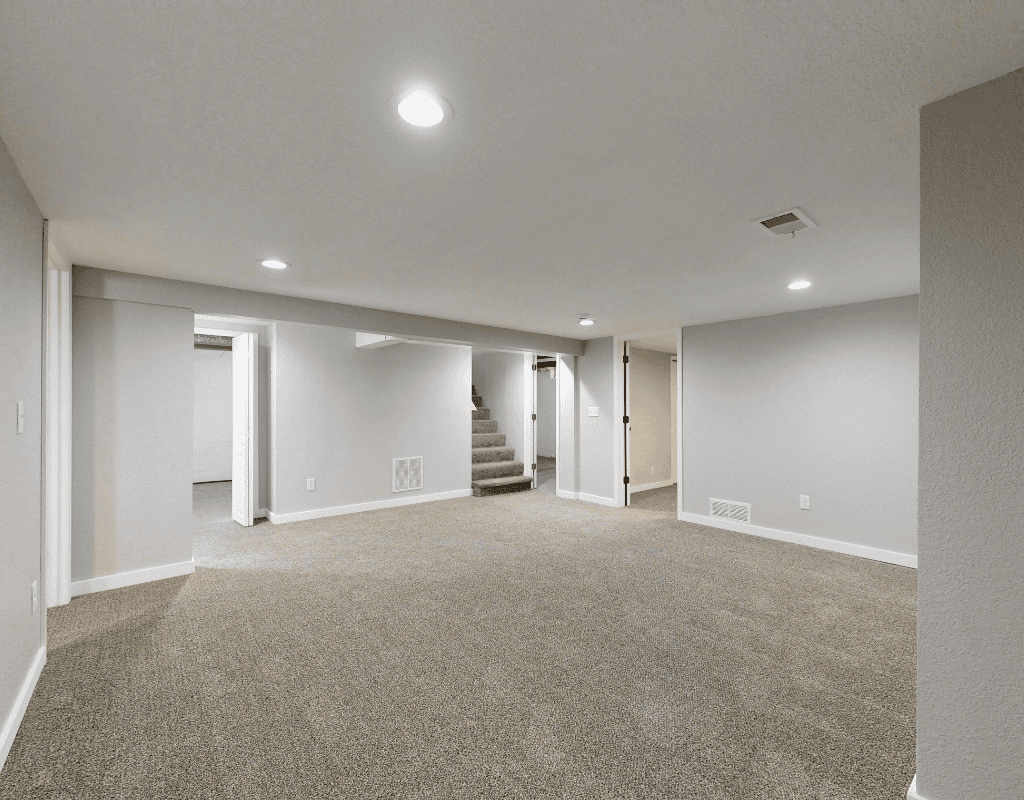 Professional cleaner in protective suit sanitizing interior surfaces during post-construction cleaning in Greater Houston