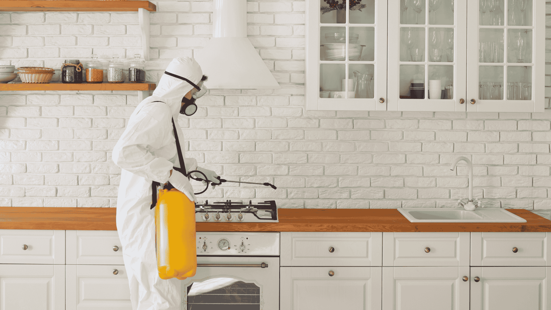 Professional cleaner wiping glass surface to remove construction dust during post construction cleaning