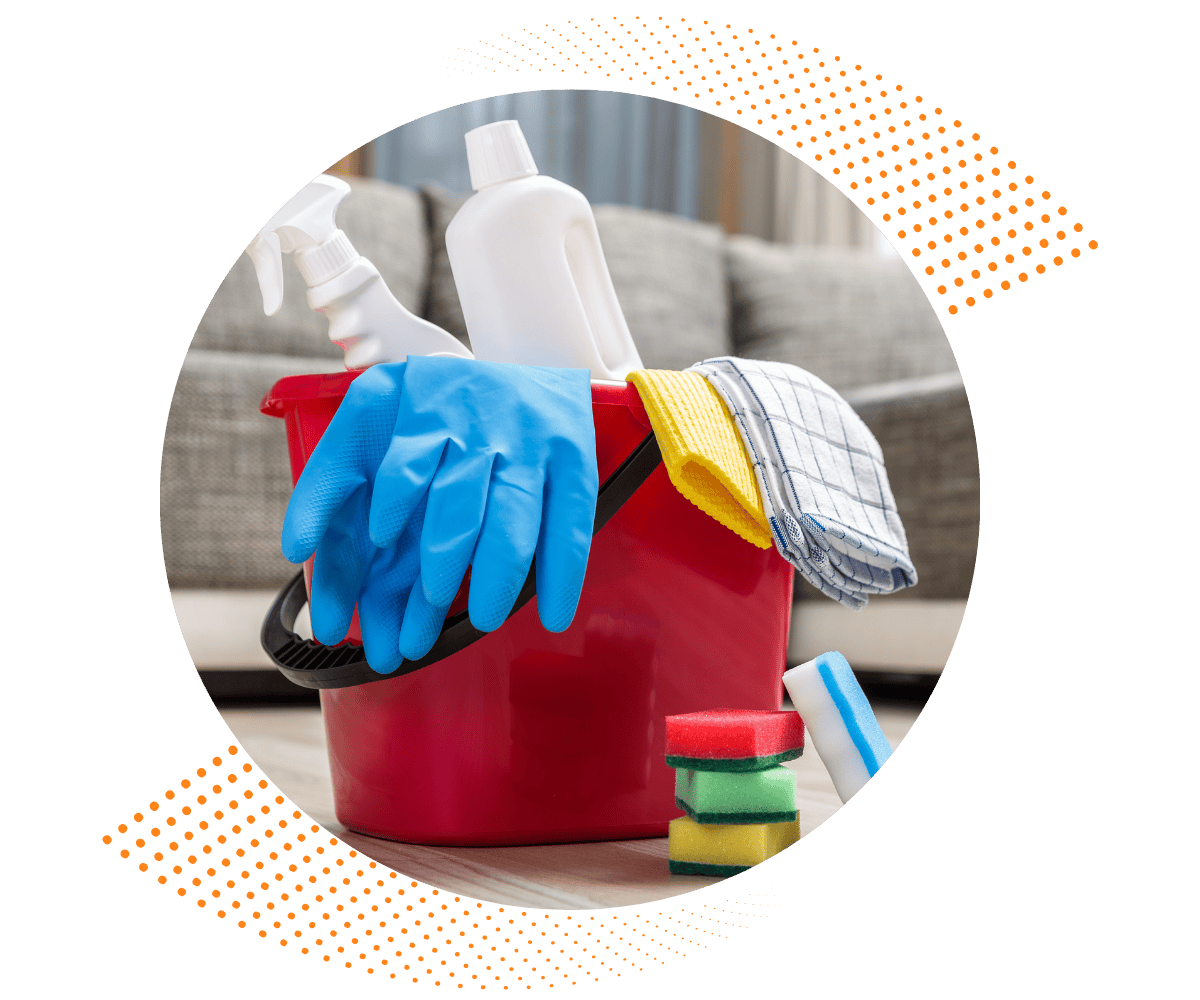 Bucket with cleaning supplies including gloves, sprays, and cloths used by house cleaning professionals in Greater Houston