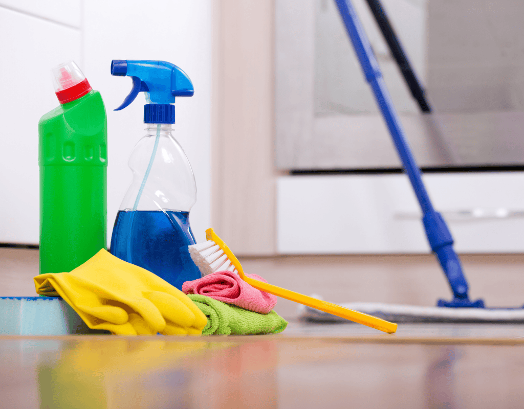 Professional cleaner mopping hardwood floor during scheduled recurring house cleaning service in Greater Houston