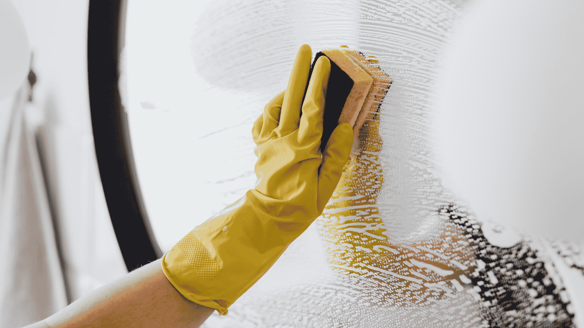 Professional cleaner mopping floor with cleaning supplies for scheduled recurring house cleaning service