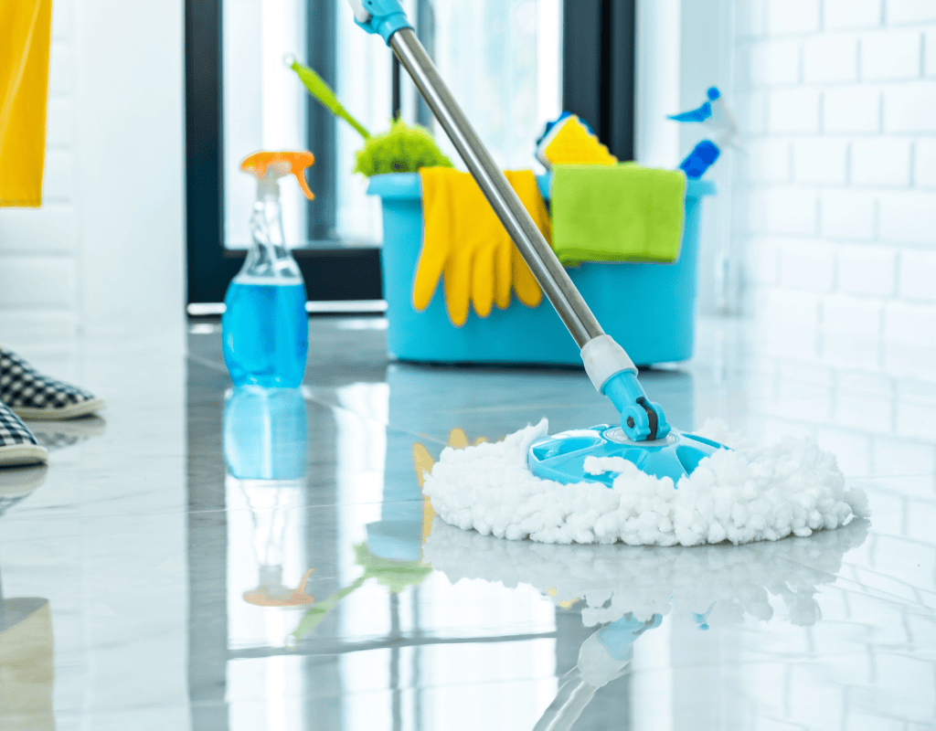 Cleaning supplies including spray bottles, gloves, and cloths used for standard house cleaning service in Greater Houston