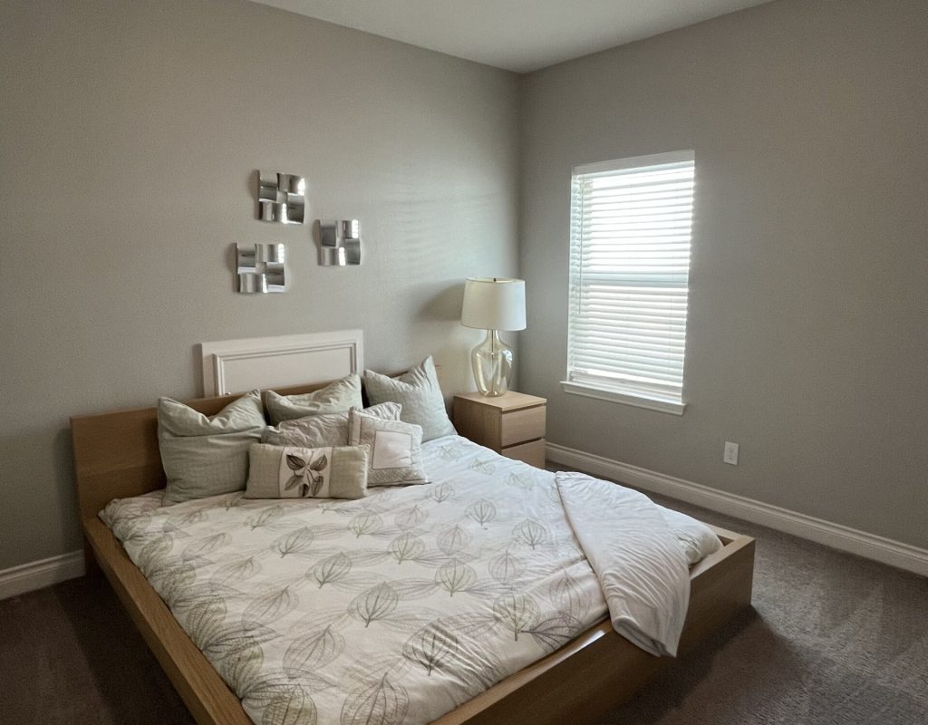 Professional cleaners dusting furniture and disinfecting high touch areas