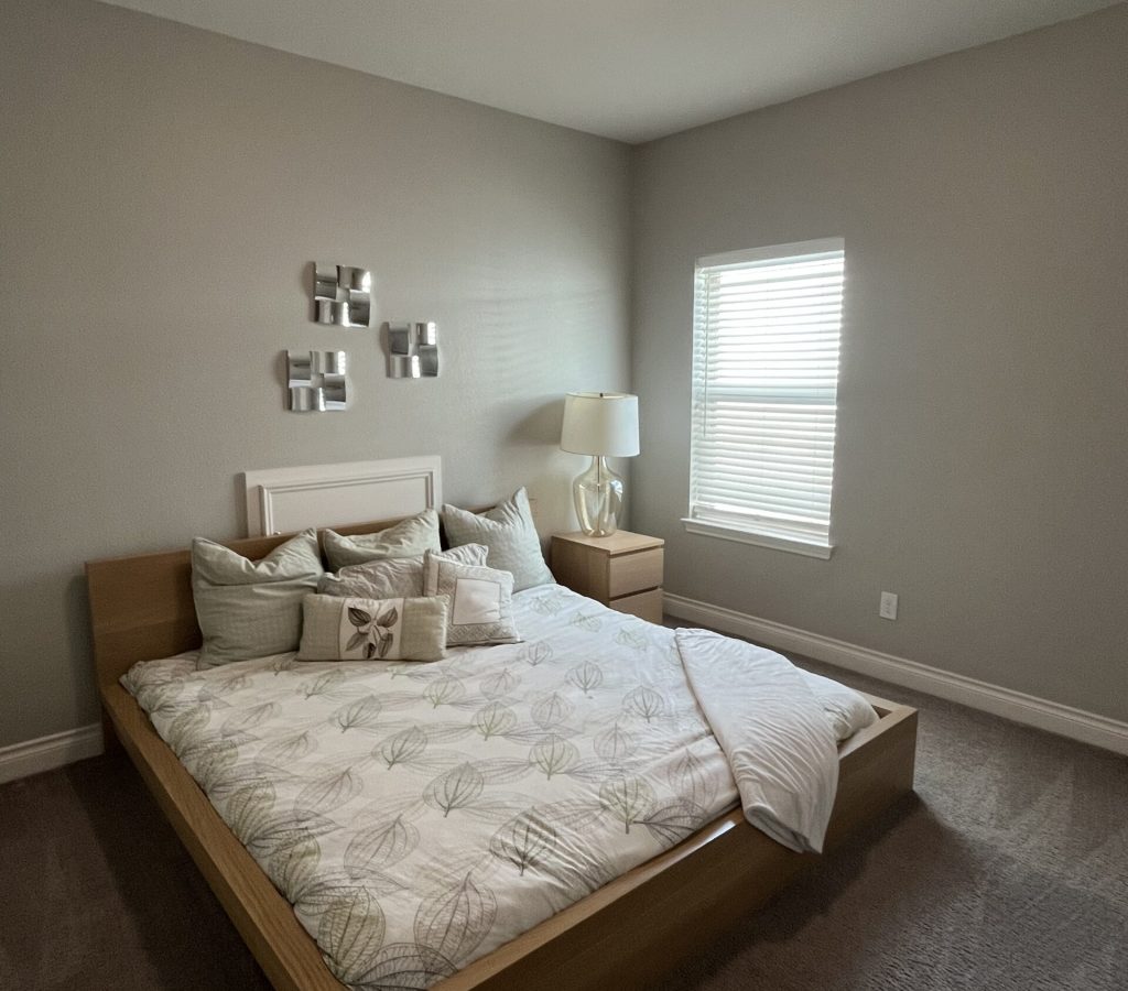 Professional cleaners dusting furniture and disinfecting high touch areas