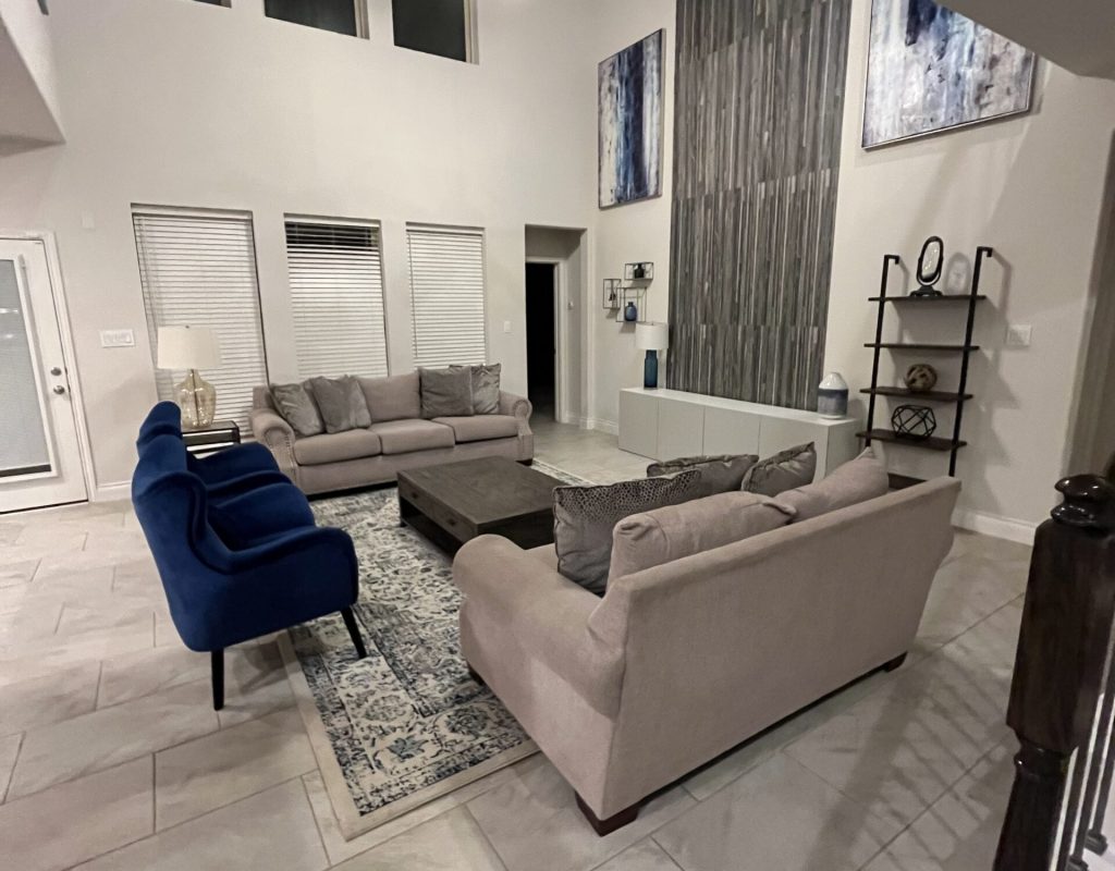 House cleaning service vacuuming floors and sanitizing household surfaces